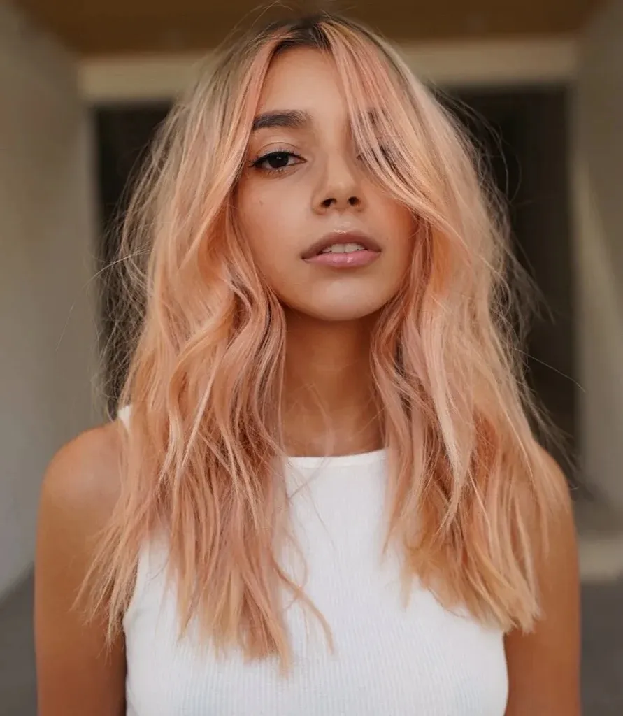 A women in white cut sleeves top showing her Coral Copper hair color A women in white cut sleeves top showing her Coral Copper hair color - dark red hair dye
