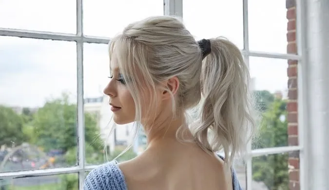 Woman in sky blue knitted dress and The Wavy Pony Woman in sky blue knitted dress and The Wavy Pony - 2022 trendy haircuts