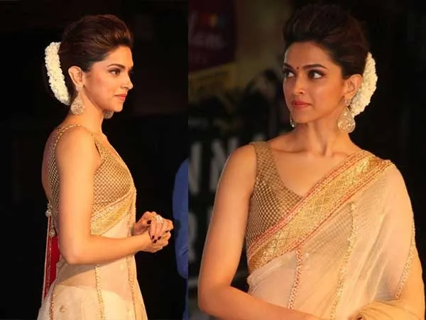 Deepika Padukone in Golden saree with cut sleeves blouse and gajra with her traditional type of bun Deepika Padukone in Golden saree with cut sleeves blouse and gajra with her traditional type of bun - Deepika Padukone Bun hairstyles
