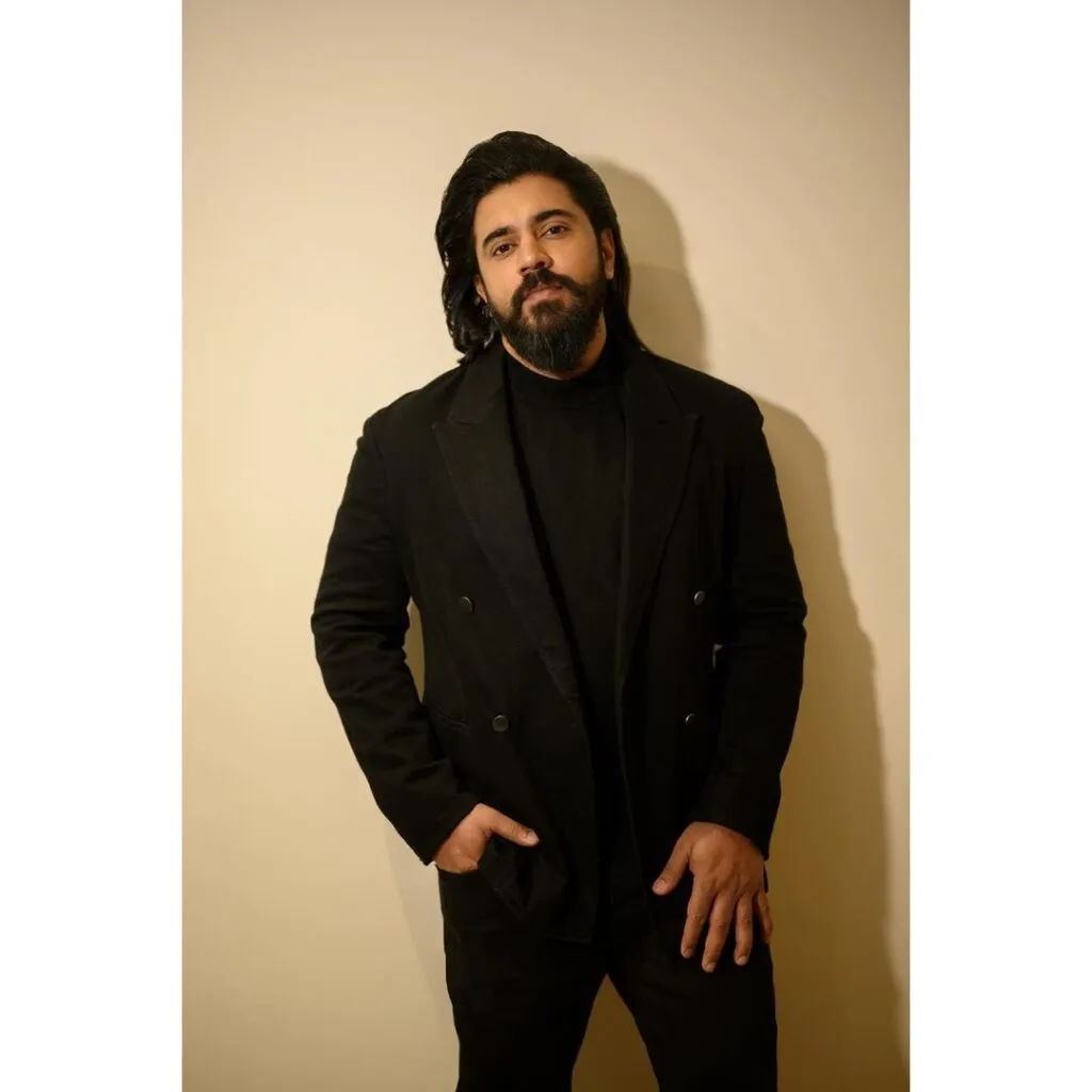 Nivin Pauly in all black look posing for camera Nivin Pauly in all black look posing for camera - south indian handsome actors