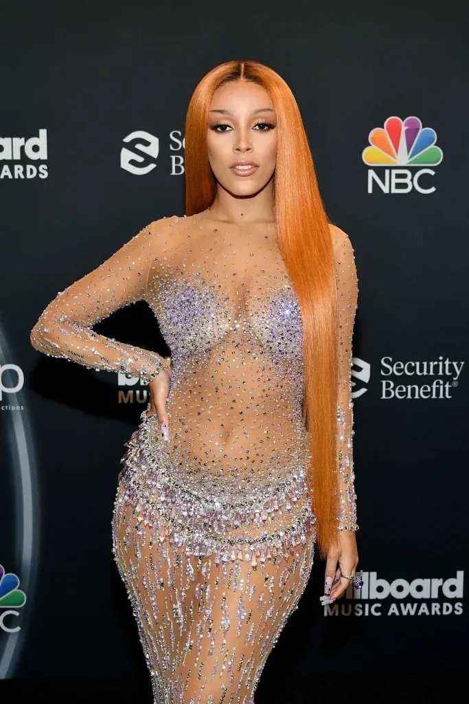 A women in skin color and stones dress showing her Orange Sherbet hair color A women in skin color and stones dress showing her Orange Sherbet hair color - red hair color shades