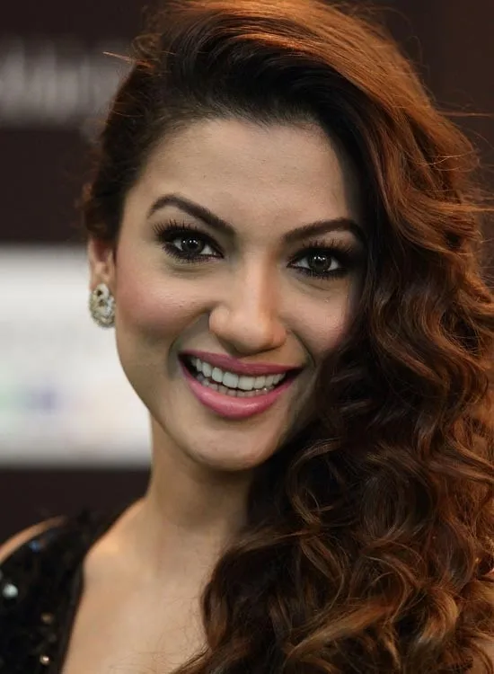 Gauhar Khan in black cut sleeves dress and curly open hair Gauhar Khan in black cut sleeves dress and curly open hair - bollywood actresses haircut