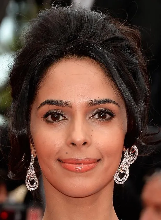 Malika Sherawat in white long earrings and bun hairstyle Malika Sherawat in white long earrings and bun hairstyle - bollywood actresses haircut 2022