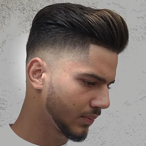 A boy in white t-shirt showing his Pompadour Fade A boy in white t-shirt showing his Pompadour Fade - Hair Cut for Boys 2022
