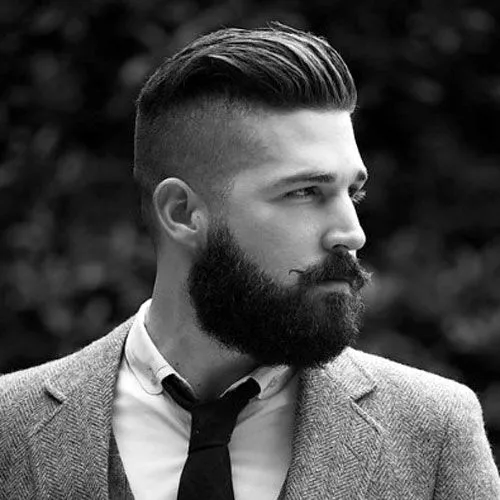 A man in grey suit showing his Slick Back Undercut with Long Beard A man in grey suit showing his Slick Back Undercut with Long Beard - Short Hairstyle for Men