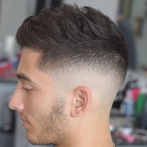 A man is showing the side view of his Textured Mid Skin Fade A man is showing the side view of his Textured Mid Skin Fade - Popular Haircut For Men in 2022