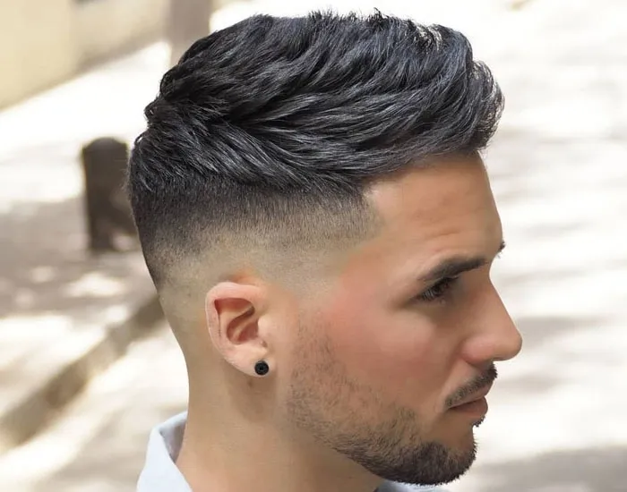A man in white shirt showing the side view of his high tape Fade Haircut A man in white shirt showing the side view of his high tape Fade Haircut - short haircut