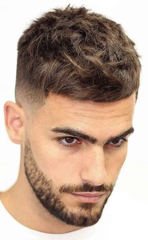 A men in white t-shirt showing his french crop haircut A men in white t-shirt showing his french crop haircut - short haircut for men