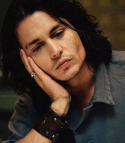 Johnny Depp in blue denim shirt with a wrist band Johnny Depp in blue denim shirt with a wrist band - Johnny Depp Wavy Hairstyle