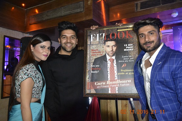 Guru randhawa launched a fitness magazine - he is with a co founders of magazine - 3 people is in this picture. Guru Randhawa wore black attires.