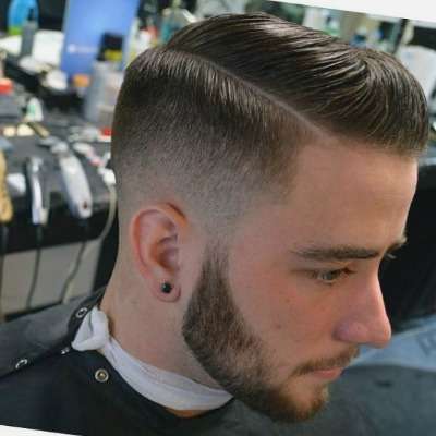 Man in black outfit and Hard Side Part hairstyle - mens haircuts list