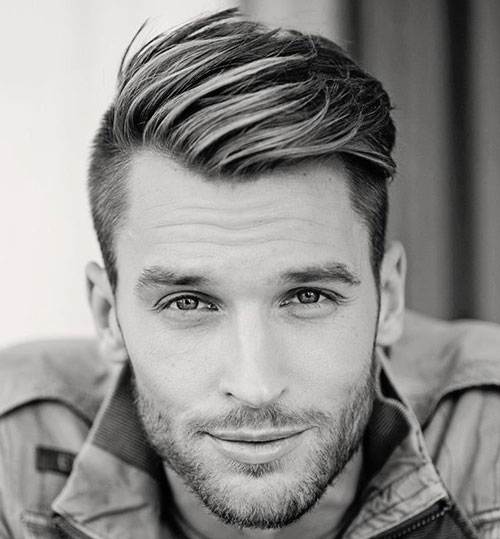 man in denim jacket and Top Sweep hairstyle - haircuts for men fade