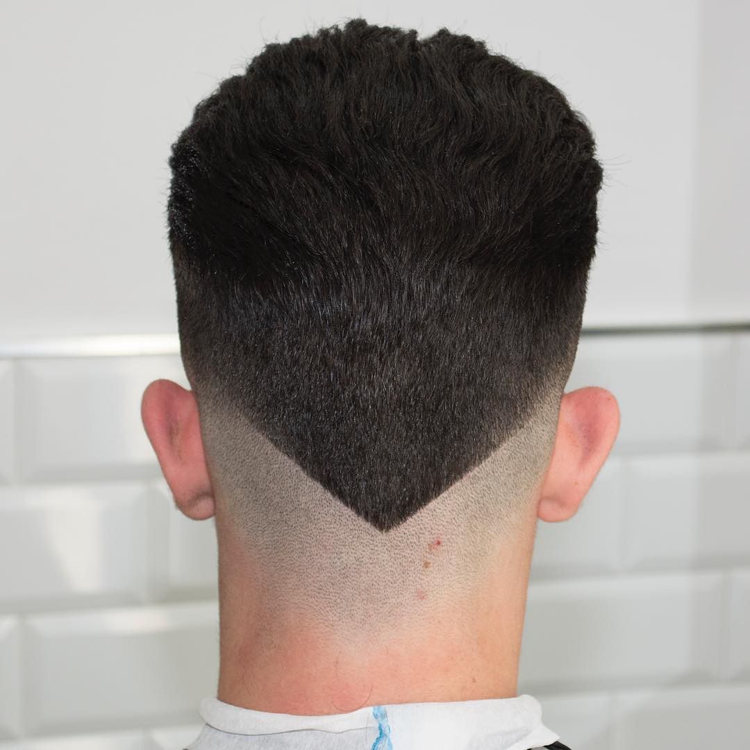 man showing the back view of her V Neckline haircut - haircuts for men with long hair