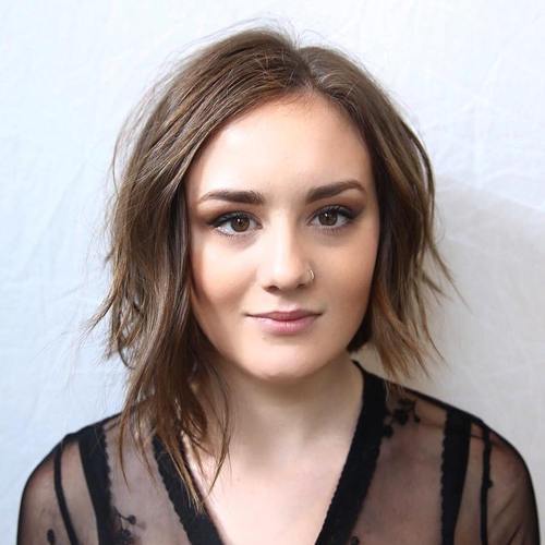 A woman in black see through dress and Asymmetrical Bob hairstyles - daily hairstyles for medium hair
