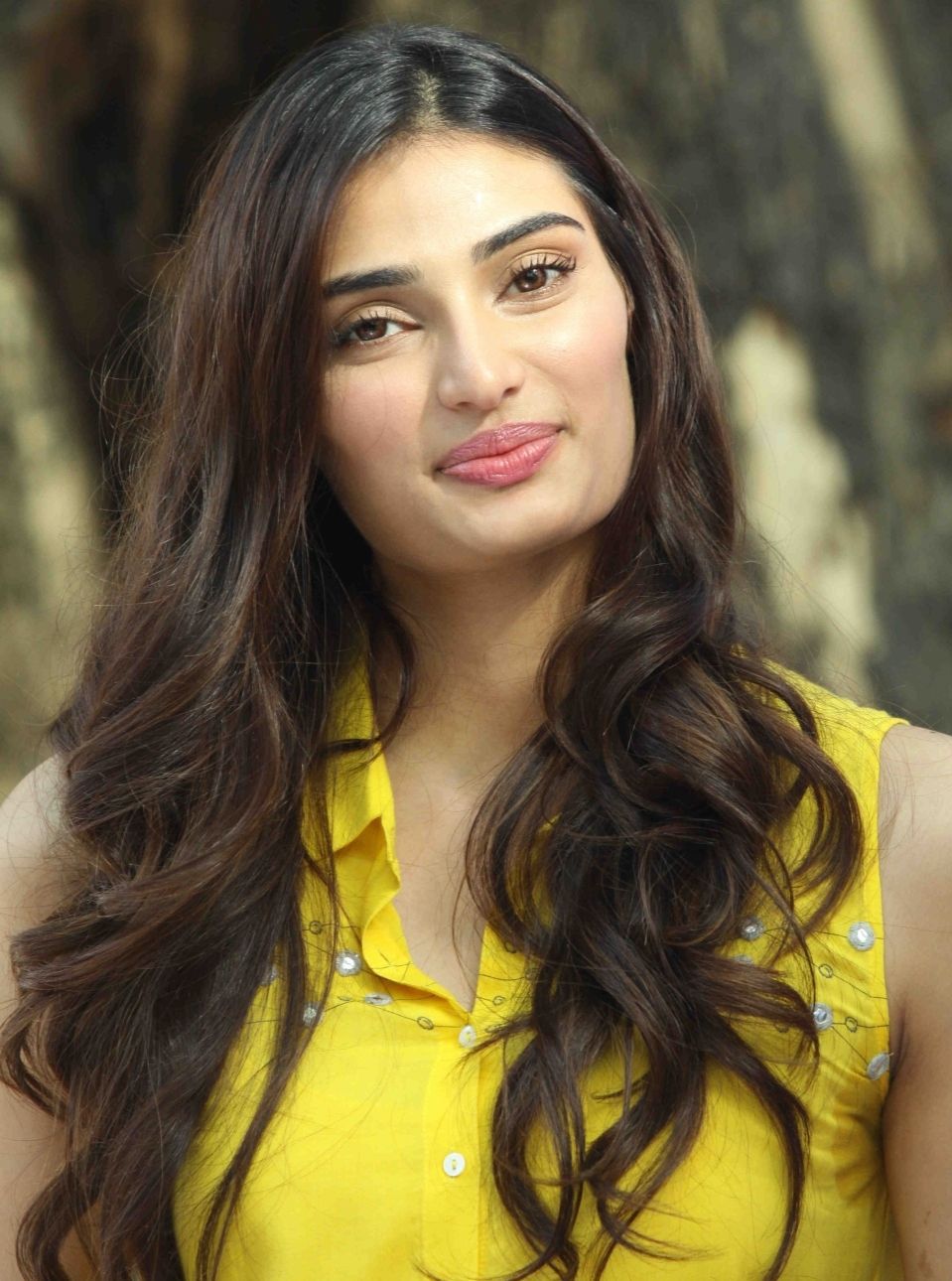 Athiya Shetty in yellow dress posing for camera - most beautiful Indian girl
