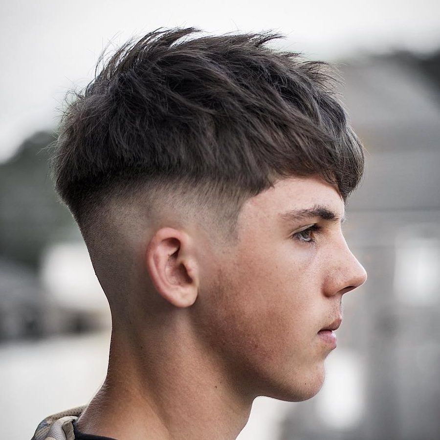 A man is showing the side view of his Bright Crop Hairstyle - hairstyles for Men 2022