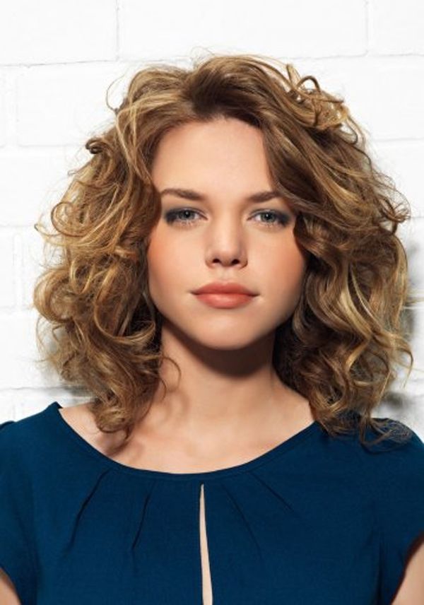 Woman in blue top and Curly Wet Set Hairstyle - hairstyles for medium hair indian