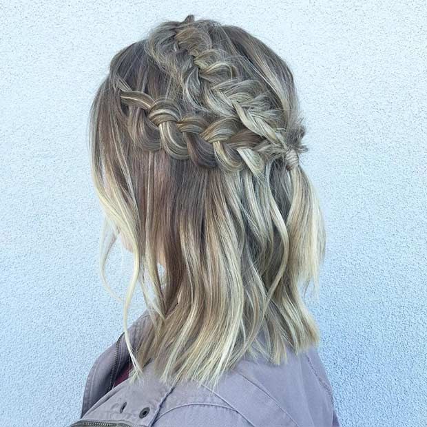 A woman in light blue denim jacket and Half Dutch Braid hairstyle - hairstyles for girls with medium hair