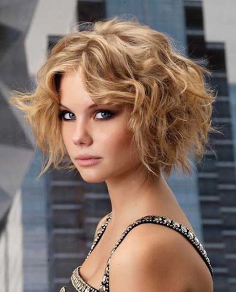 A woman in black and silver embroidery dress and Highlighted Curls hairstyles - haircuts for girls with medium hair