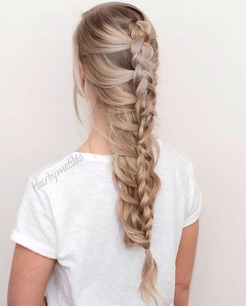 A girl in white t-shirt showing the back view of het Mermaid Braid - hairstyles for long hair