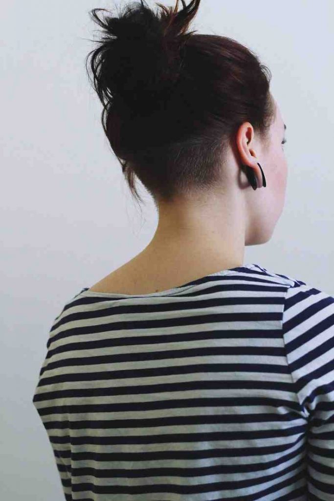 Woman in black and white lining top showing the back view of her Nape Undercut Hairstyle - simple hairstyles for dresses