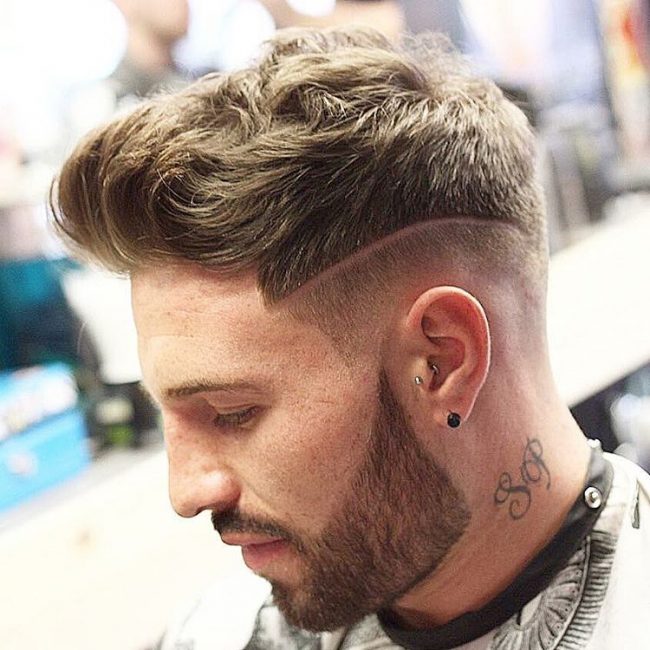 A man with a tattoo on his neck showing his Slick with Surgical Lines hairstyle - short hairstyles for boys 2021