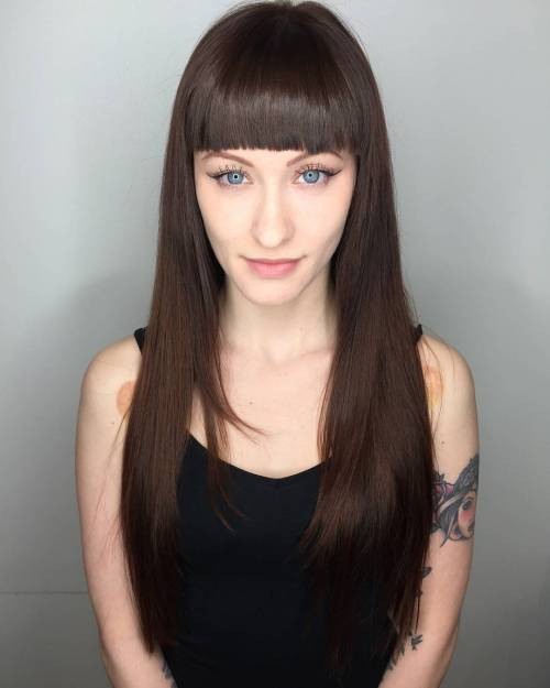 Woman in black cut sleeves top and Straight Bangs Straight Hairstyle - hairstyles for straight long hair