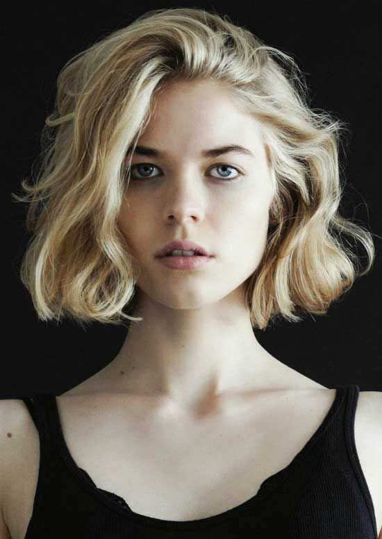 Woman in black tank top with Wavy Bob Hairstyle - simple hairstyles for dresses