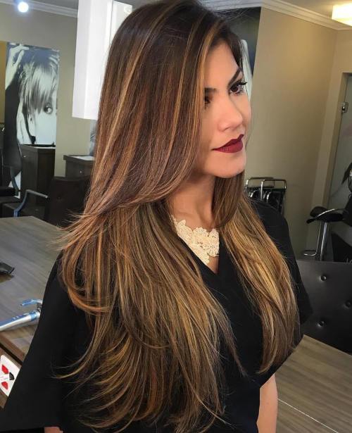 Woman in black dress and Straight Tresses - best hairstyles for long hair female