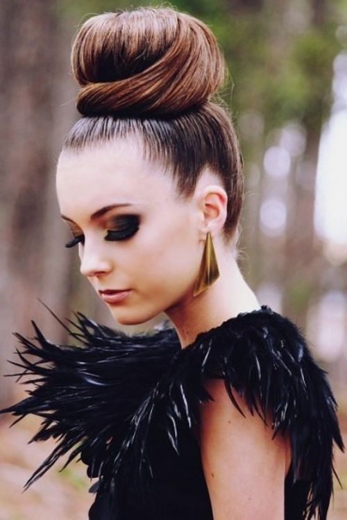 Woman in black furry dress with golden earrings and Top Bun hairstyle - best hairstyle for girl with long hair