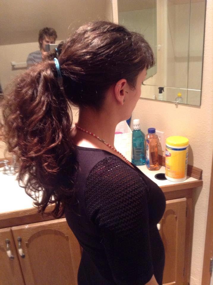 Woman in black top and Wavy Pixie - hairstyle for long hair on jeans top