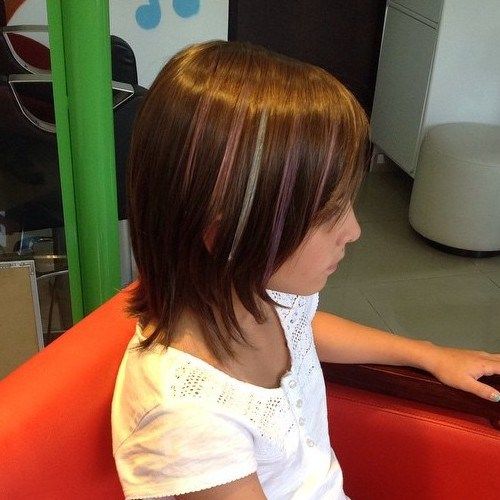 A girl in white round neck top showing the side view of her Layered bob with highlights - Teenage Girls hairstyles