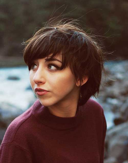 A girl in maroon high neck sweatshirt showing the side view of her Short & wavy shag - Haircut Teenage Girls