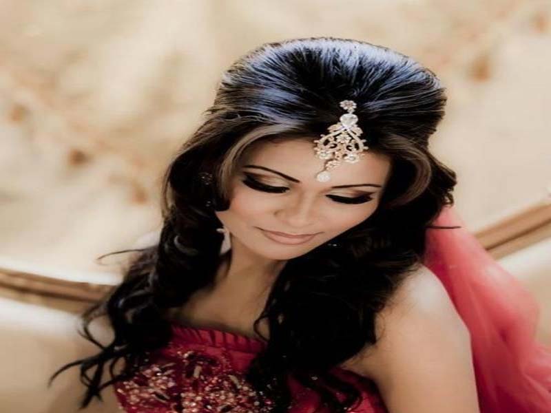 Woman in red traditional dress with Puff Hairstyles - hair cutting style for female with name