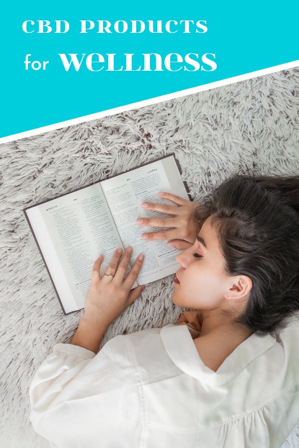 cbd wellness products for sleep - girl is sleeping with her book