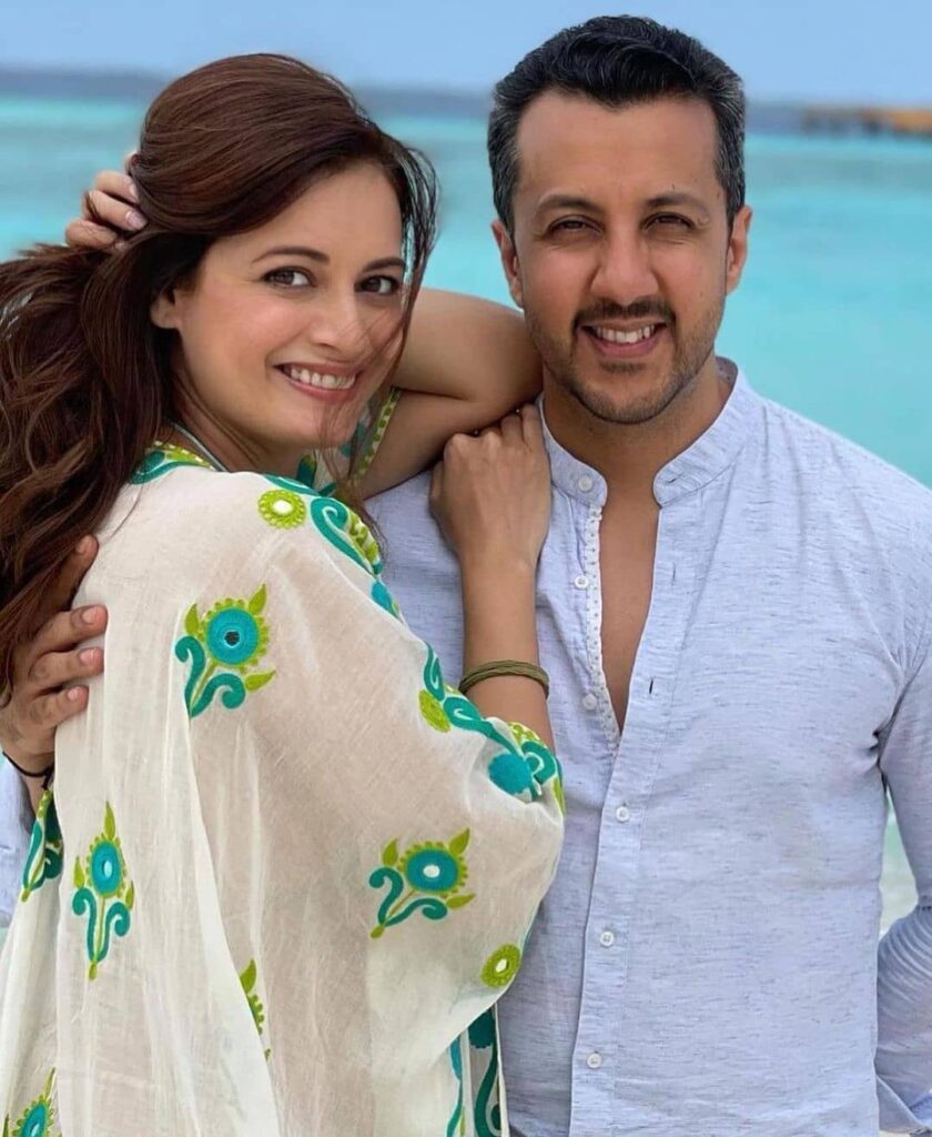Dia Mirza posing for camera in a floral printed dress with husband Vaibhav Rekhi - celebrities married in 2021