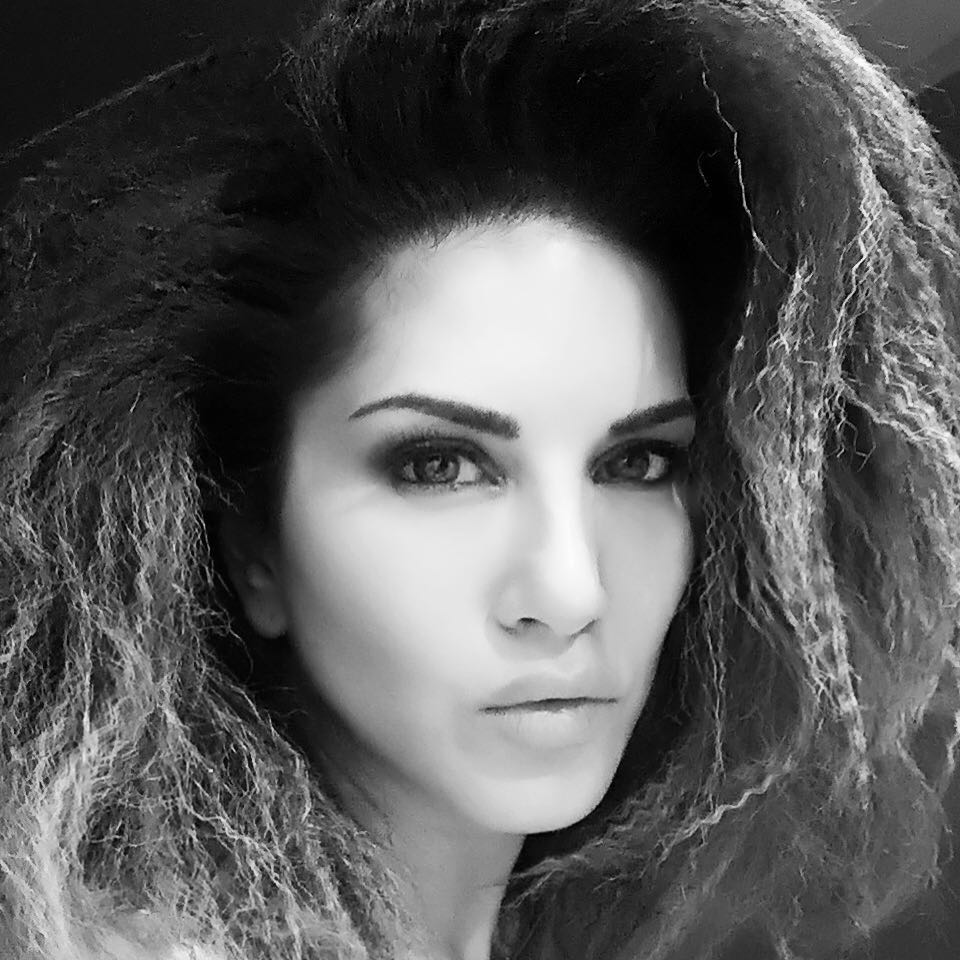 In a black and white picture Sunny Leone showing her permed hair - Sunny Leone Hairstyle short