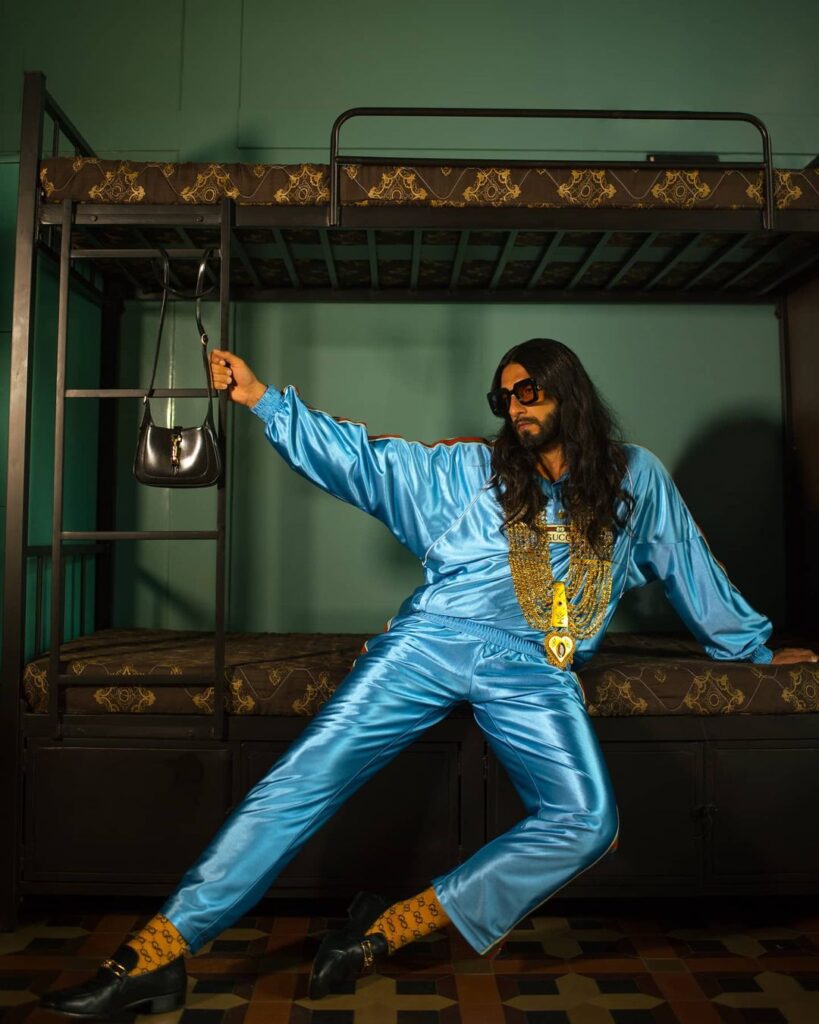 Ranveer Singh in complete blue attire and golden jewelries with his long locks - Ranveer Singh best hairstyles