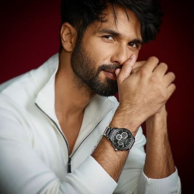 Shahid Kapoor in white attire smiling and posing for camera - shahid kapoor hairstyles images 
