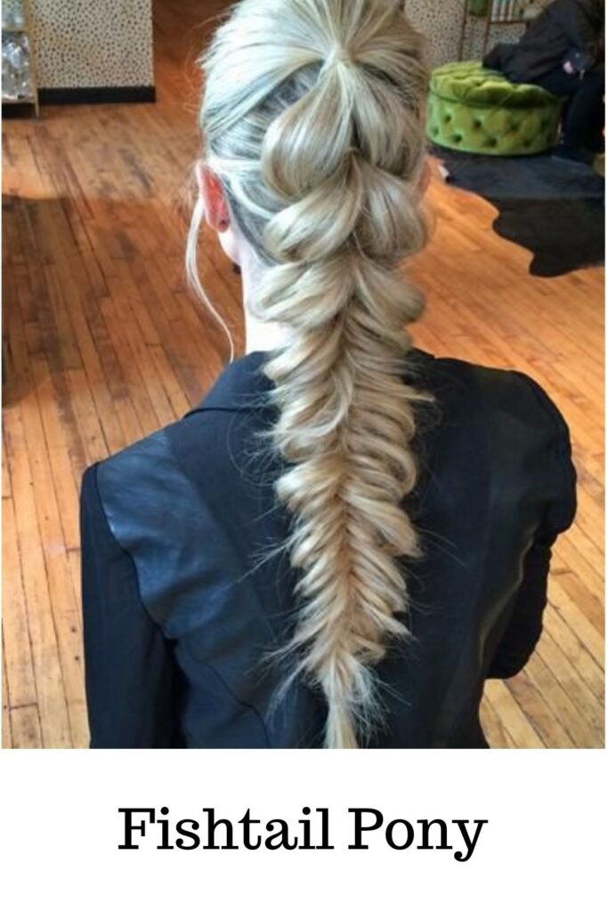A lady is blue dress and ash blonde hair color showing her Fishtail Pony A lady is blue dress and ash blonde hair color showing her Fishtail Pony - ponytail hairstyles braids