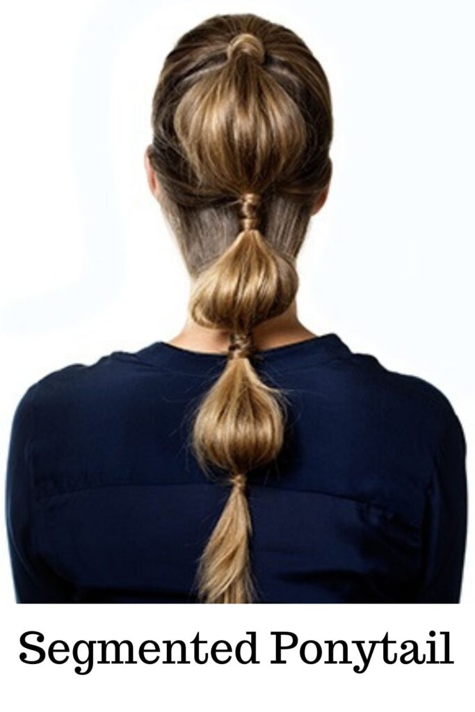 A lady in blue dress is showing her Segmented Ponytail - ponytail hairstyles for long hair