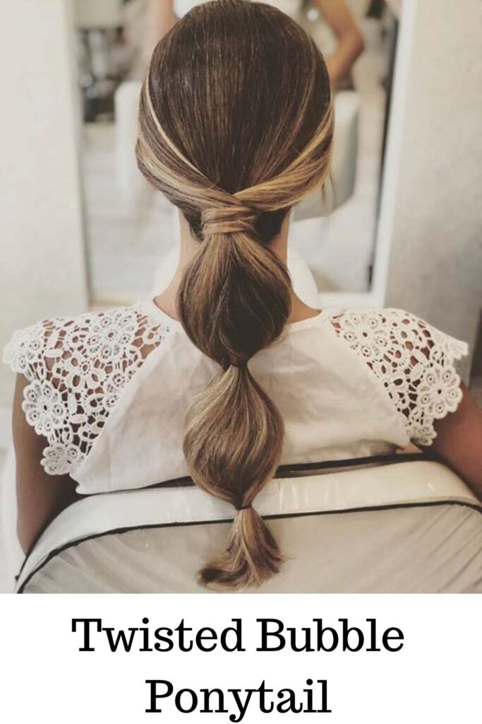 A girl with blonde hair showing her Twisted bubble ponytail - ponytail hairstyles for long hair