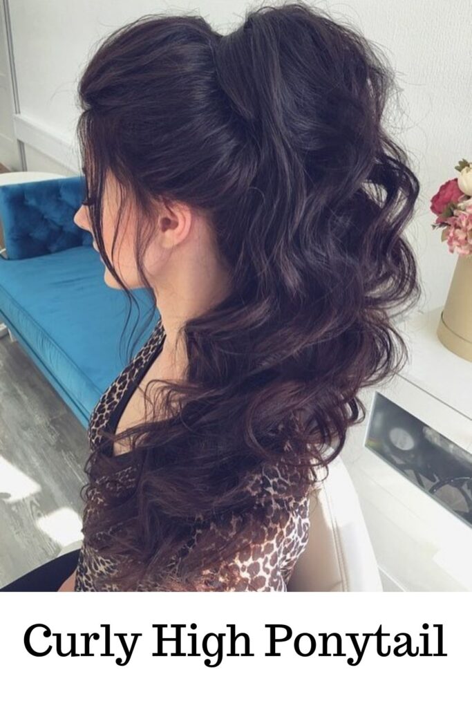 A lady in printed top showing her curly high ponytail A lady in printed top showing her curly high ponytail - ponytail curls hairstyles