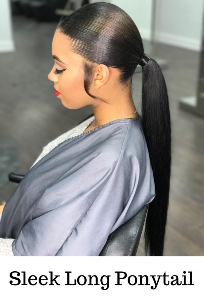 A woman in white and grey dress showing off her sleek long ponytail -  ponytail extension for black hair