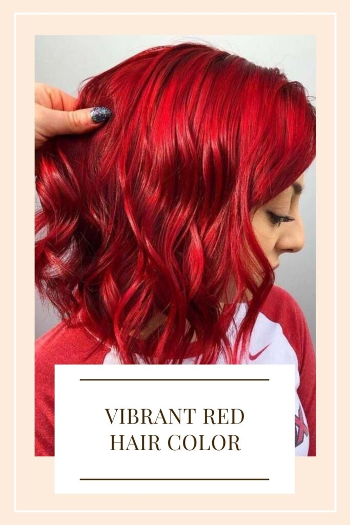 A girl in medium length hair with Vibrant Red Hair color - new hair color trends 2021