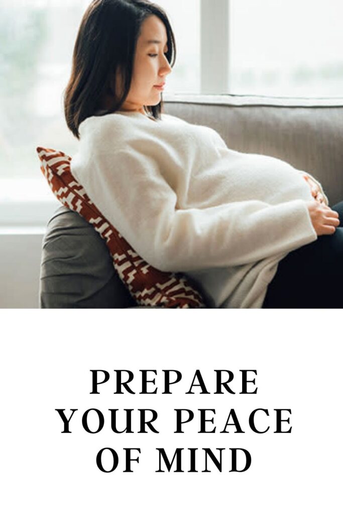 A pregnant lady in white dress resting on a couch -Things to Prepare Before Labour  