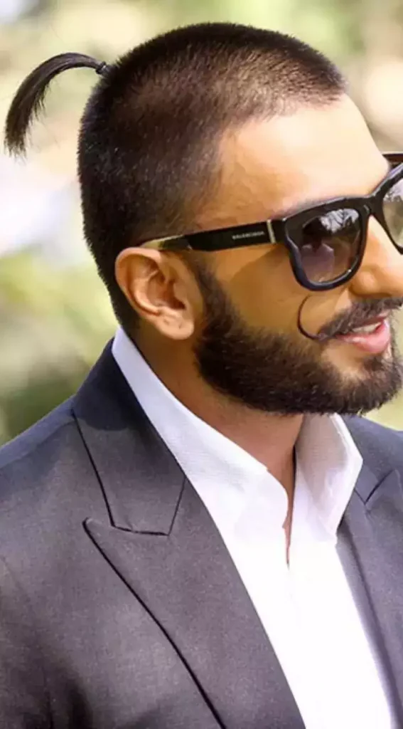 Ranveer Singh in Goggles showing his bald look with Ponytail - Ranveer Singh Long Haircut