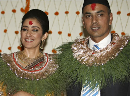 Manisha Koirala and her ex-husband Samrat Dahal smiling and posing in their wedding outfit - bollywood divorces 2021