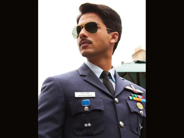 Shahid Kapoor in navy Uniform giving a side pose - shahid kapoor hairstyles name