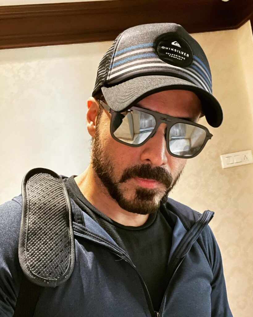 Imran Hashmi wearing a cap and goggle and posing for a selfie - bollywood handsome actors